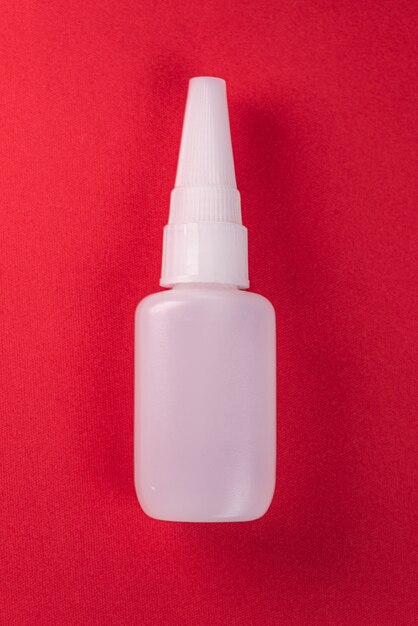 Close up details of a glue bottle isolated