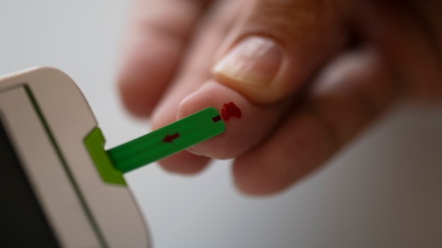 Free photo close up on diabetic person checking their glucose levels