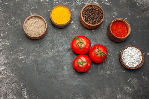 Close up of different spices lined in bowls