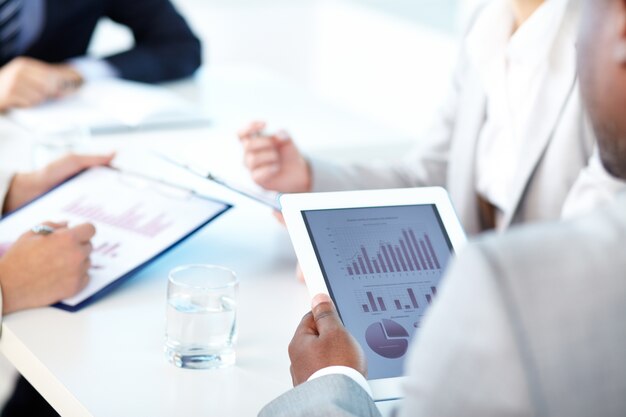 Close-up of digital tablet in a meeting