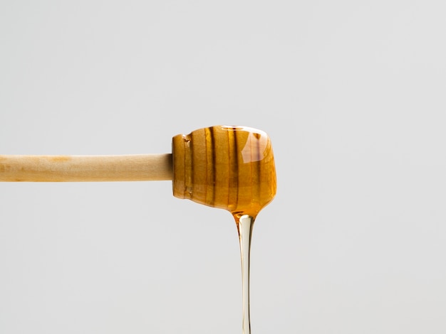 Close up dipper covered in honey