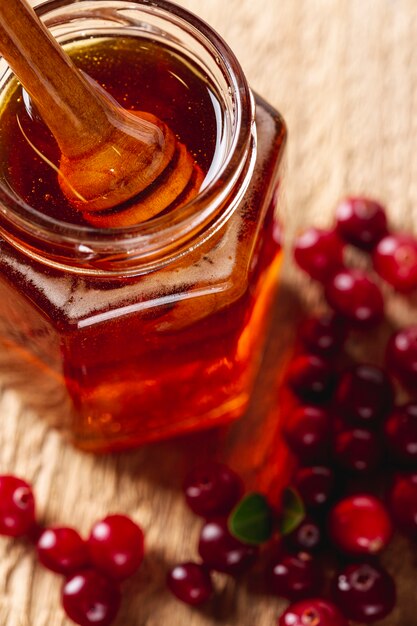 Close up dipper in honey jar