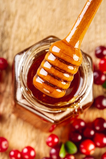 Free photo close up dipper and honey jar