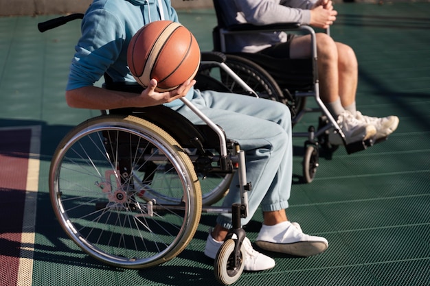 Free photo close up disabled friends with ball