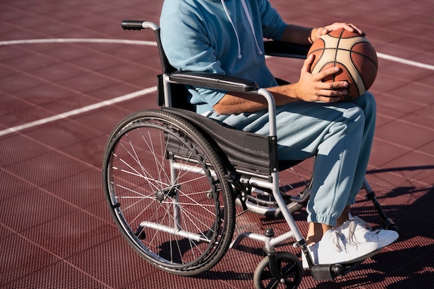 Free photo close up disabled man with ball