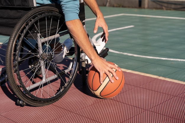 Close up disabled person holding ball