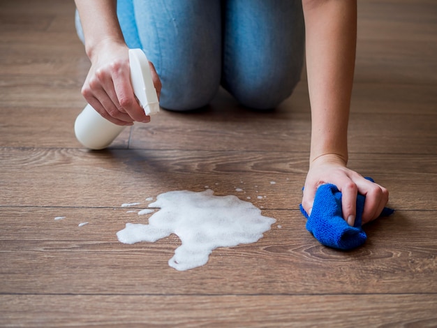 Close-up disinfecting the floor with chemicals