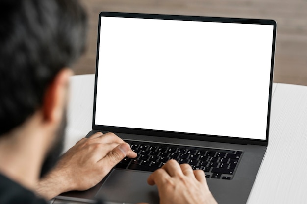 Close-up doctor browsing laptop