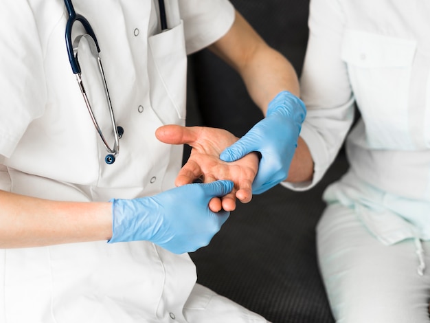 Close-up doctor checking joints