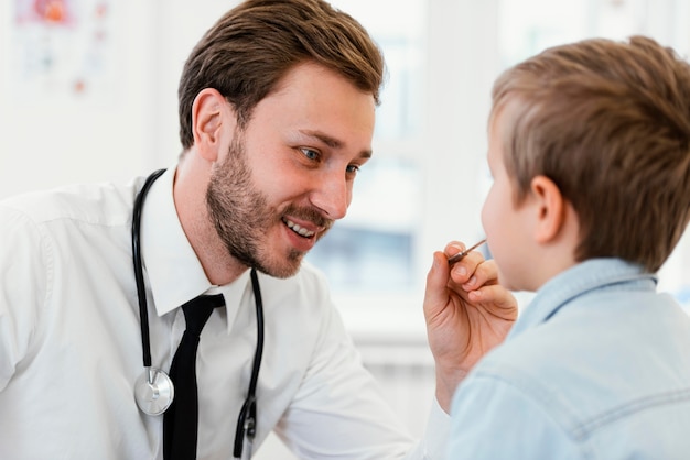 Close-up doctor checking kid