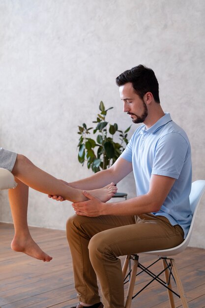 close up doctor checking leg