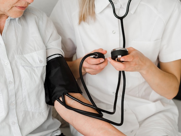 Close-up doctor checking patient