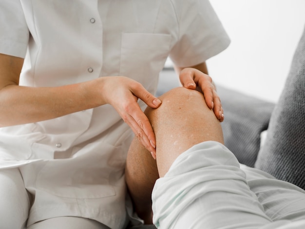 Close-up doctor checking patient