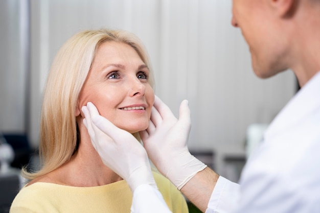 Close up doctor checking patient