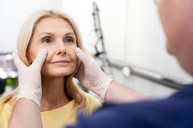 Close up doctor checking patient