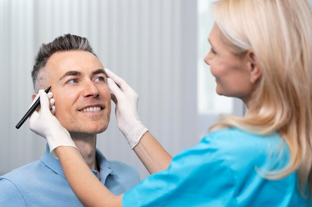 Close up doctor checking smiley patient
