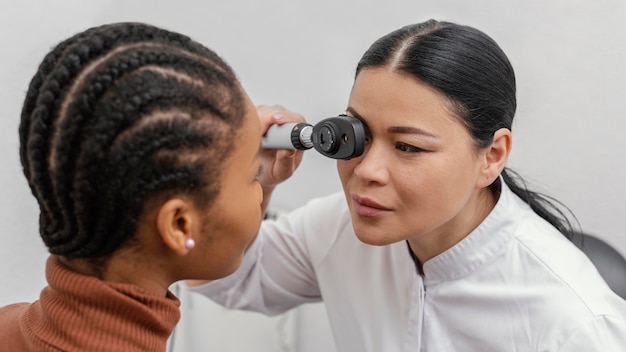 Free photo close up doctor checking woman