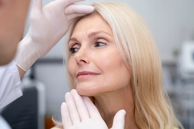 Close up doctor checking woman