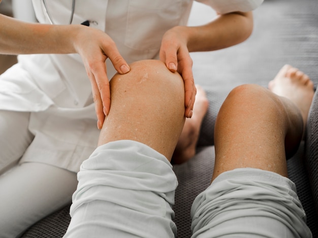 Close-up doctor examines patient