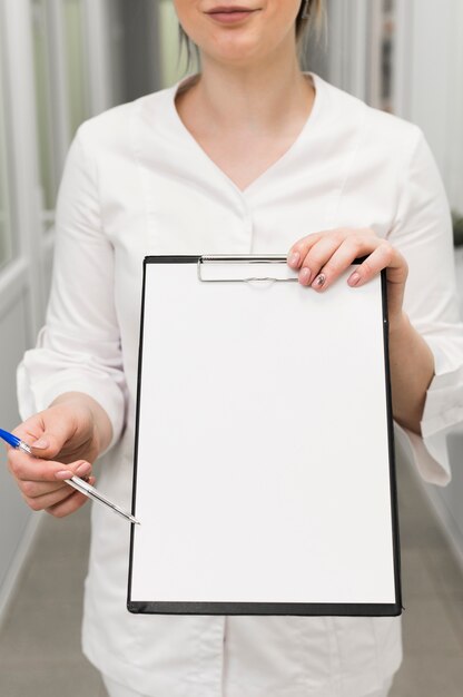Close-up doctor holding clipboard
