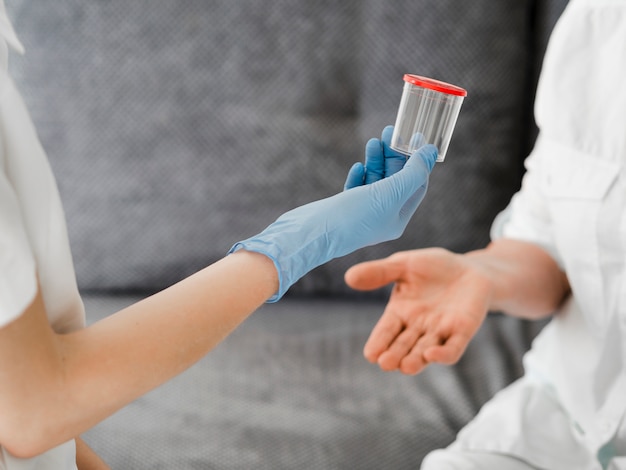 Close-up doctor holding container