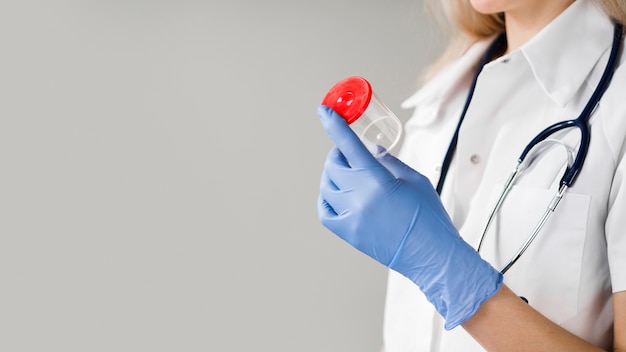 Close-up doctor holding container