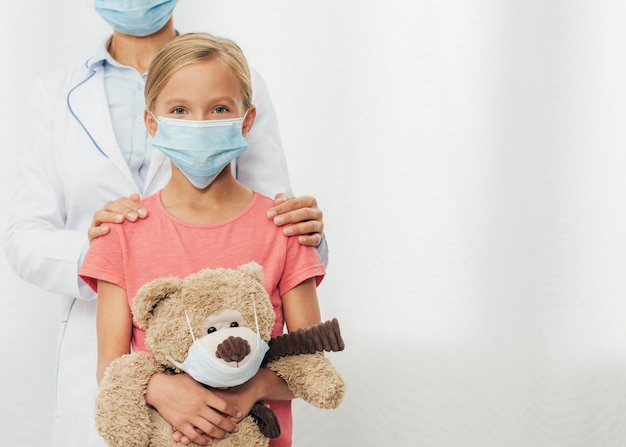 Close-up doctor holding girl