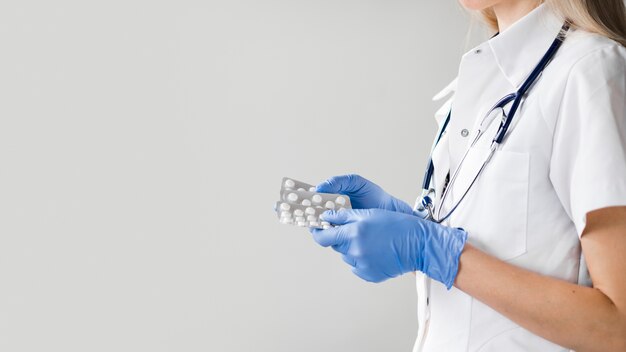 Close-up doctor holding medication