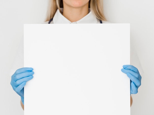 Close-up doctor holding paper