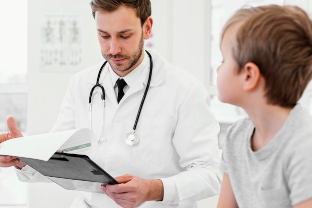 Close-up doctor looking at chart