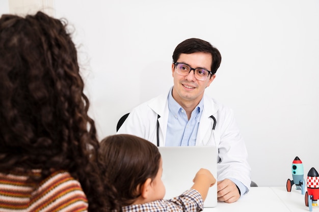 Close-up doctor looking at the patient