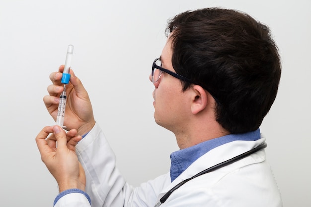 Free photo close-up doctor measuring the right dose