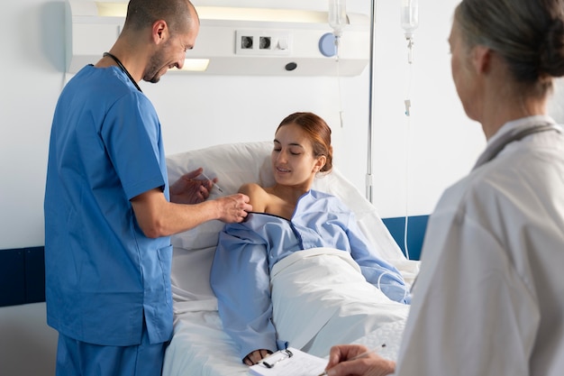 Close up doctor and nurse helping patient