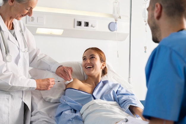 Close up doctor and nurse helping woman