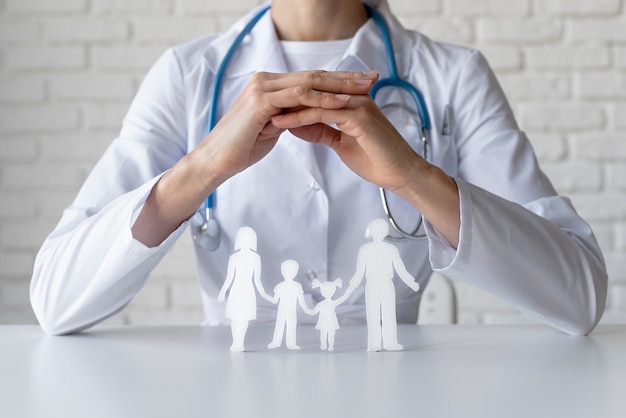 Free Photo close up doctor and paper family