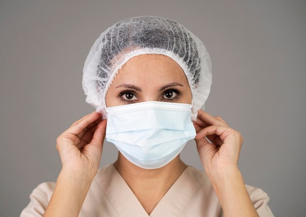 Close-up doctor wearing medical mask