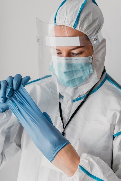 Close-up doctor wearing protective wear