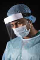 Free photo close up doctor with protective equipment