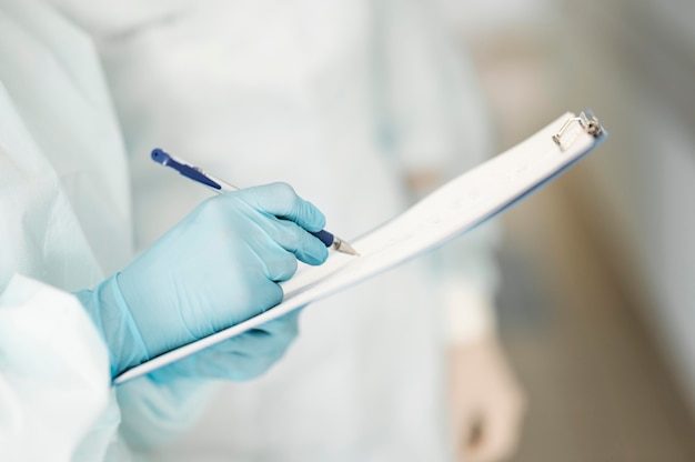 Close-up doctors completing medical form