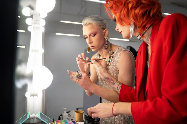 Close up drag queens getting ready