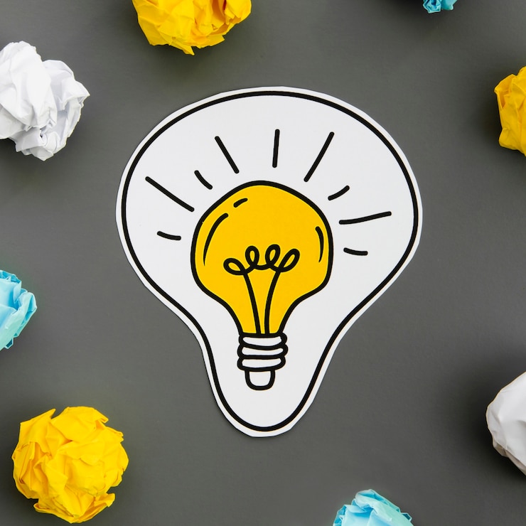 Free Photo close-up drawing of a light bulb and crumpled paper