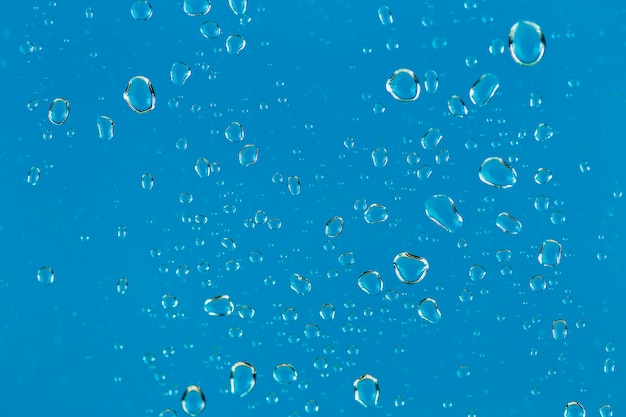 Close-up drops on blue background