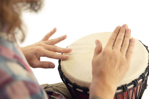 Close up of drummer hands playing drum