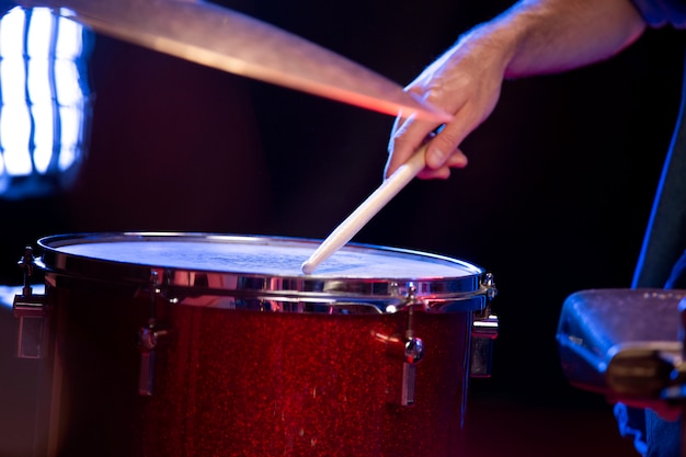 Close up drummer performing at concert