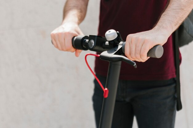 Close up e-scooter rider with defocused background