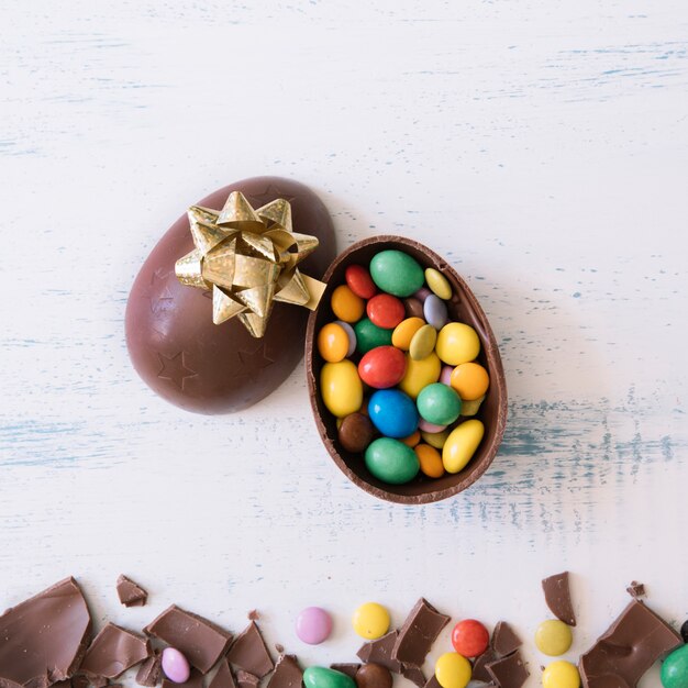 Close-up egg with candies and bow