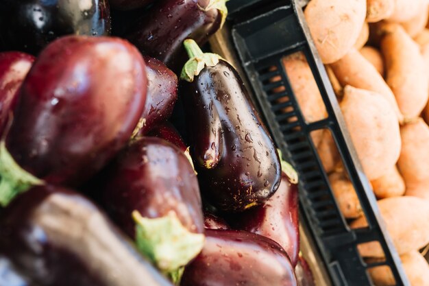 Close-up of eggplants in crate for the sale