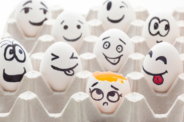Close-up eggs with emoji drawing