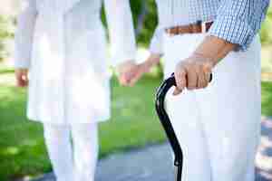 Free photo close-up of elderly woman with walking stick