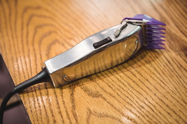 Close-up of electric trimmer on dressing table